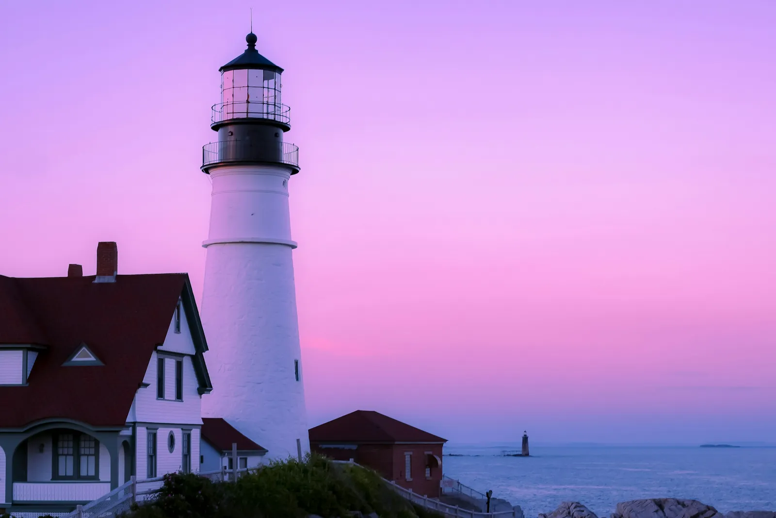 A lighthouse overlooking a rocky coastline